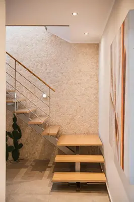 a staircase in a room with a brick wall at Villa Jamila by Cura Villas Collection in Kalathas