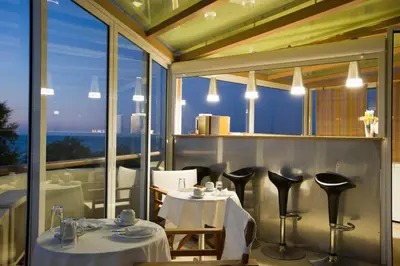 a restaurant with two tables and a view of the ocean at Seafalios in Kalamaki Chanion
