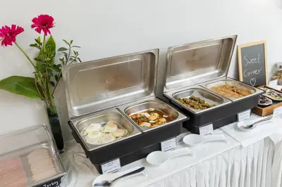 three trays of food sitting on top of a table at Athina Beach Hotel in Kato Daratso