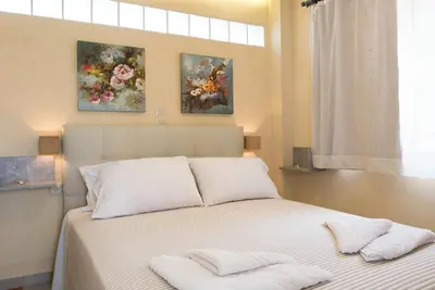 a bedroom with a bed with two pillows on it at Pantanassa Villa Thalia in Agia Marina Nea Kydonias