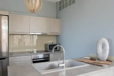 a kitchen with a sink and a microwave at Pantanassa Villa Thalia in Agia Marina Nea Kydonias