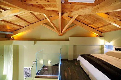 a bedroom with a bed and a glass table at Elia Fatma Boutique Hotel in Chania Town