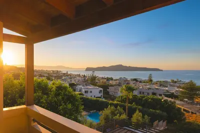 a view of the ocean from a house at Seaview Garden Villa - Heated Pool & Sauna in Stalos