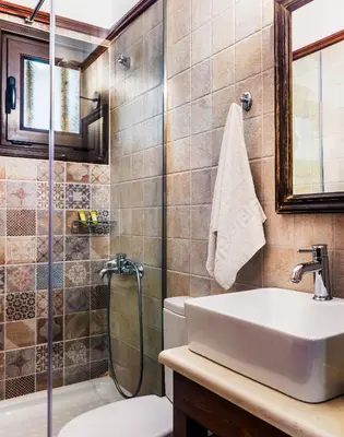a bathroom with a sink and a shower at Villa Merabello in Agia Marina Nea Kydonias