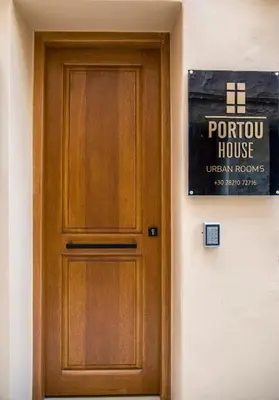 a wooden door on the side of a house at Portou House in Chania Town