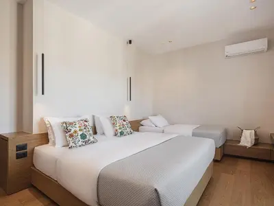 a bedroom with two beds in a room at Theofilos City Hotel in Chania Town