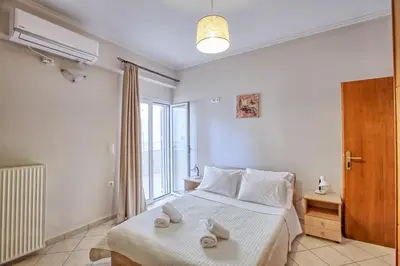 a bedroom with a bed with two towels on it at Gianna's House in Gerani Chanion