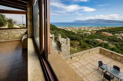 a balcony with a view of the ocean at Villa dimitris in Kissamos