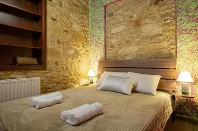 a bedroom with a bed with towels on it at Villa dimitris in Kissamos