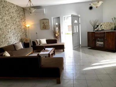 a living room with two couches and a table at Rosy's House with all Amenities near Chania in Chania Town