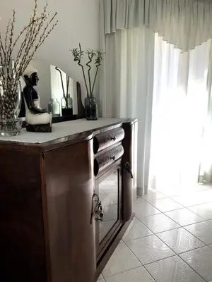 a bathroom with a counter with a woman statue on it at Rosy's House with all Amenities near Chania in Chania Town