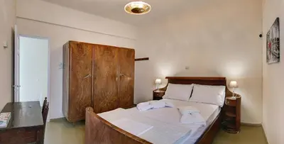 a bedroom with a bed with two towels on it at Emmanouil’s House in Chania Town