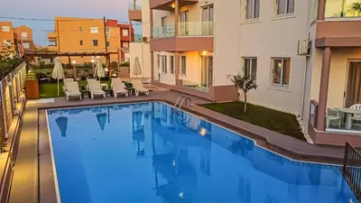 a swimming pool in the middle of a building at Oliva Beach Hotel in Maleme