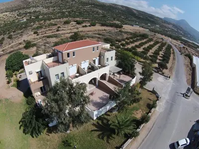 an aerial view of a house with a vineyard at Nikos Apartments in Falasarna