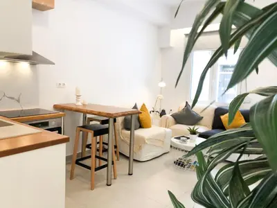 a living room with a table and a couch at Stelisia Rooms in Chania Town