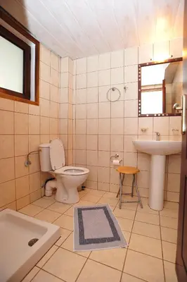 a bathroom with a toilet and a sink at Kavousi Resort in Falasarna