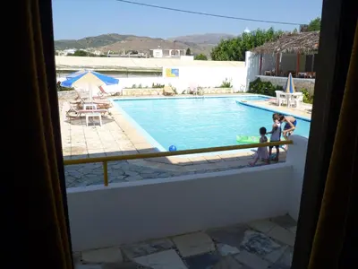 a view from a window of a swimming pool at Karmi Apartments in Kolymvari