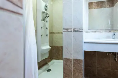 a bathroom with a shower and a sink at Vasso Apartments in Kissamos