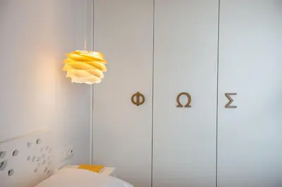 a room with a bunch of bananas on the wall at Fos Villa, a Luxe House with Private Heated Pool in Galatás