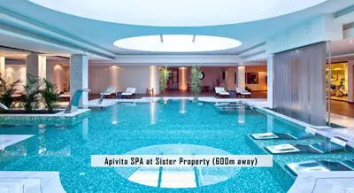 an empty swimming pool in a hotel lobby at Avra Apartments Kolymbari Harbour in Kolymvari