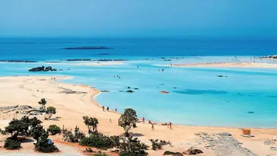 a group of people on a beach in the ocean at Irene's studio in chania in Chania Town
