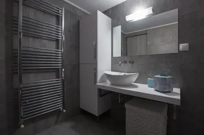 a bathroom with a sink and a mirror at Chalepa Boutique Apartment in Chania Town