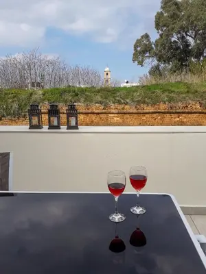 two glasses of red wine sitting on a table at Grande Casa 1926 in Chania Town