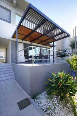 a modern house with a deck with a patio at 3 bdr apartment 5 km from the city in Agios Onoufrios