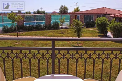 a balcony with a view of a park at Monachus Monachus in Frangokastello