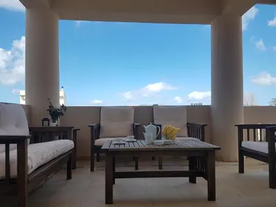 a living room with a couch and a coffee table at Rastoni Apartments in Kissamos