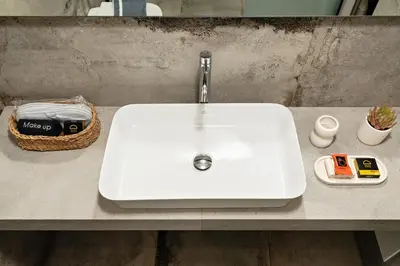 a white sink sitting on top of a counter at Morfeas Hotel in Chania Town
