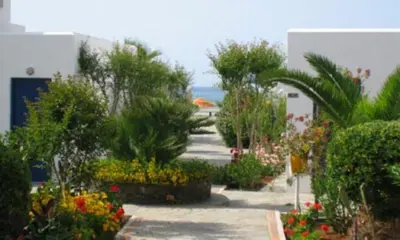 a garden with flowers and plants in a building at Marina Sands in Agia Marina Nea Kydonias