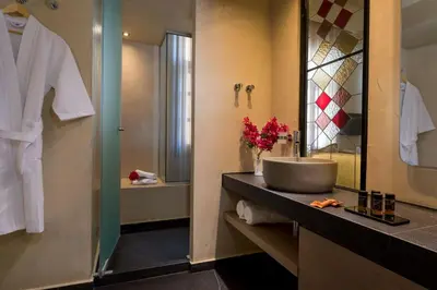 a bathroom with a sink and a mirror at ELG Contessa Boutique Hotel in Chania Town