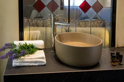 a bath tub sitting on a counter in a bathroom at ELG Contessa Boutique Hotel in Chania Town