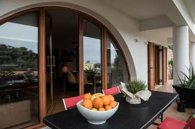 a bowl of oranges on a table in a house at Zen Serenity Retreat with Great Outdoors, Pool & Parking in Áptera