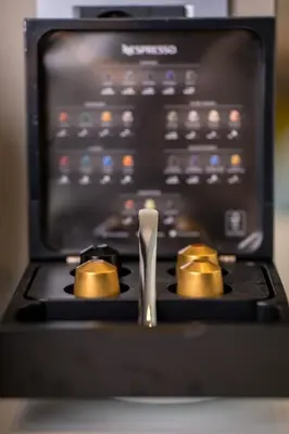a stove top with a spoon on top of it at Oniros Residences in Souda