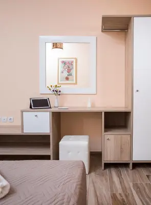 a bedroom with a desk and a bed at Georgia Sunset in Trákhilos