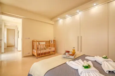 a baby room with a crib and a bed at Luxury Maisonette in Chania Town