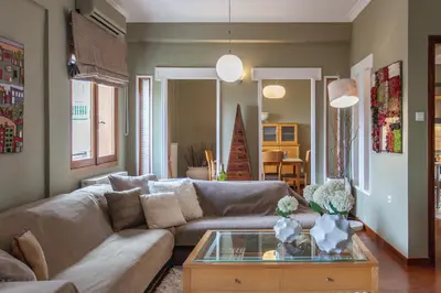 a living room with a couch and a table at Sea view maisonette in Chania Town