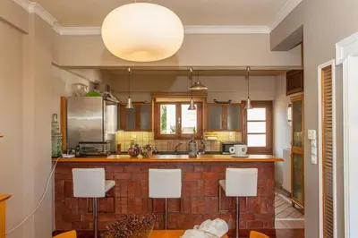 a kitchen with a sink and a counter top at Sea view maisonette in Chania Town