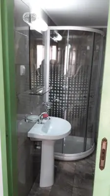 a bathroom with a sink and a shower at Anastasia Apartments in Chania Town