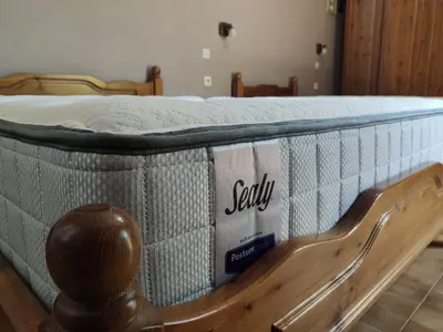 a mattress on a bed frame with a sign on it at Stelios Rooms in Palaiochóra