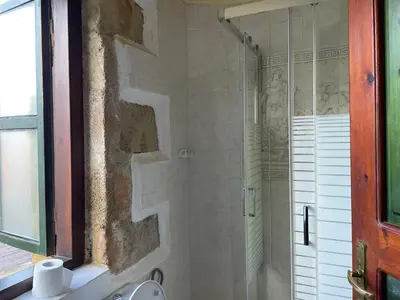 a shower with a glass door in a bathroom at Ifigenia by Captain Michalis in Chania Town