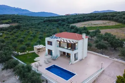an aerial view of a house with a swimming pool at Rodi Stone Villa in Kalyves