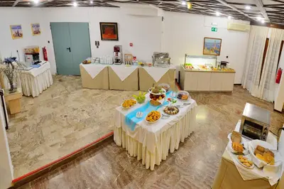 a room with a table with food on it at Elena Beach Hotel in Kissamos