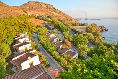 an aerial view of houses on a hill next to the water at Villas Vista Del Mar in Kissamos