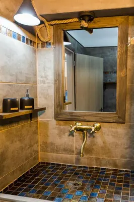 a bathroom with a sink and a mirror at EvaEle Luxury Boutique in Kissamos
