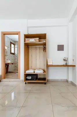 a room with a bunk bed and a mirror at Deluxe Suites in Chania Town