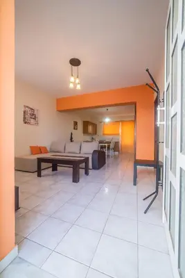 a living room with a couch and a table at Mamis Studio in Kissamos