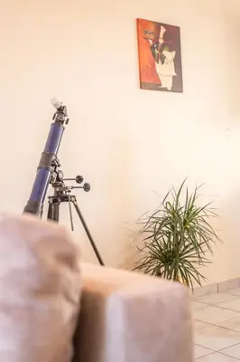 a camera and a tripod in a room with a plant at Mamis Studio in Kissamos